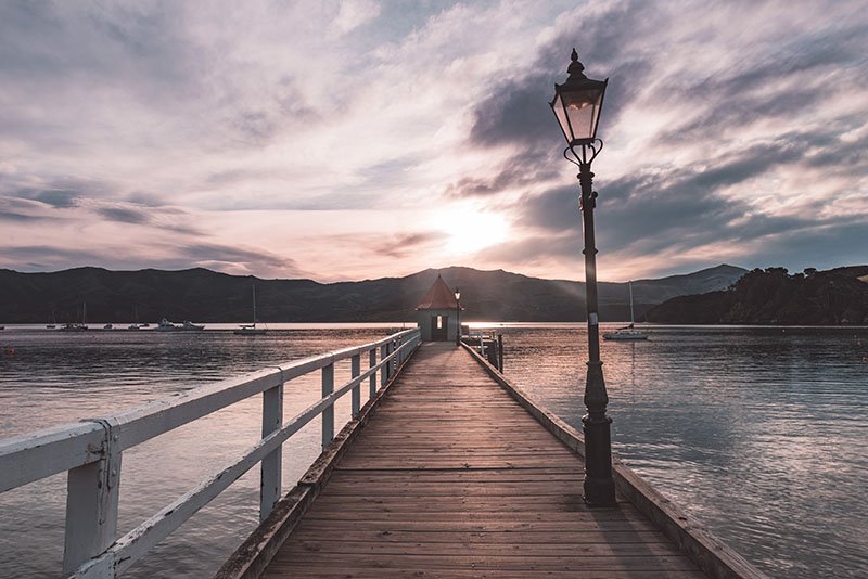 Akaroa is a small town off the beaten track in New Zealand. Find out why you should visit it!