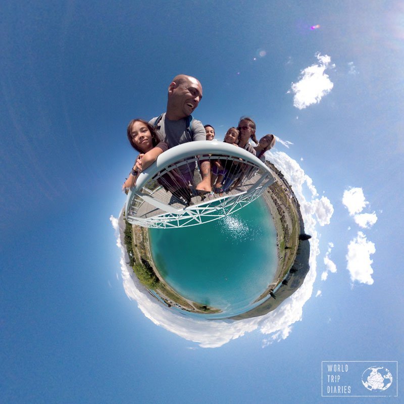 A tiny planet photo with the 6 of us on the planet, holding on a rail, and the blue waters of Lake Tekapo (NZ) on the bottom. Taken with the Garmin Virb.