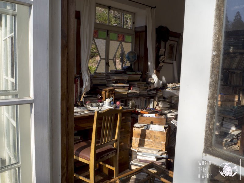 The view from a French door to the dad's study, cluttered with books, paper, pens, and more. It's exactly the same as it was in the movie My Neighbor Totoro. Ghibli Studios is great, really! Click for more!