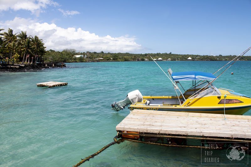 A platform on the foreground, followed by a yellow boat on the bright blue waters of Savai'i. If this isn't the life to live, I don't know what is!