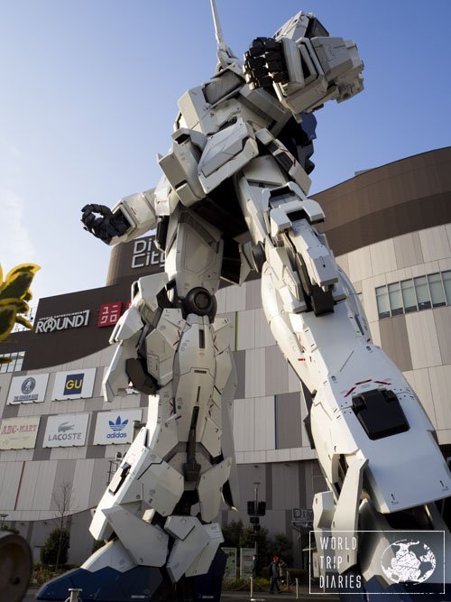 The giant Unicorn Gundam robot in front of a mall in Odaiba, Tokyo. It's so perfect we were waiting for it to move. 