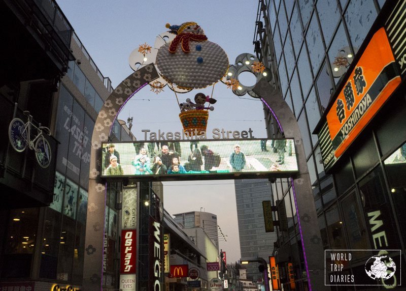 The Takeshita Dori sign (the decorated arch) with a screen showing the passers-by. Harajuku certainly is one of the best places for families in Tokyo!