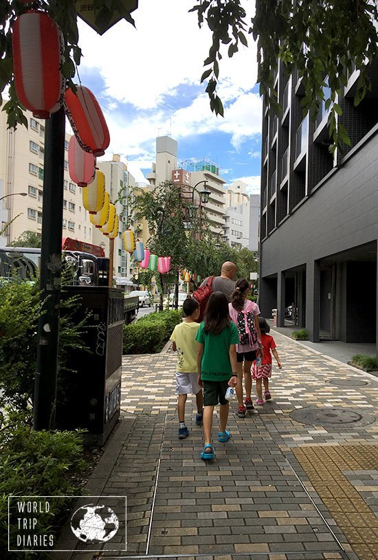 5/6 of us walking in Shibuya, Tokyo, Japan. The streets were all decorated for summer with paper lanterns.