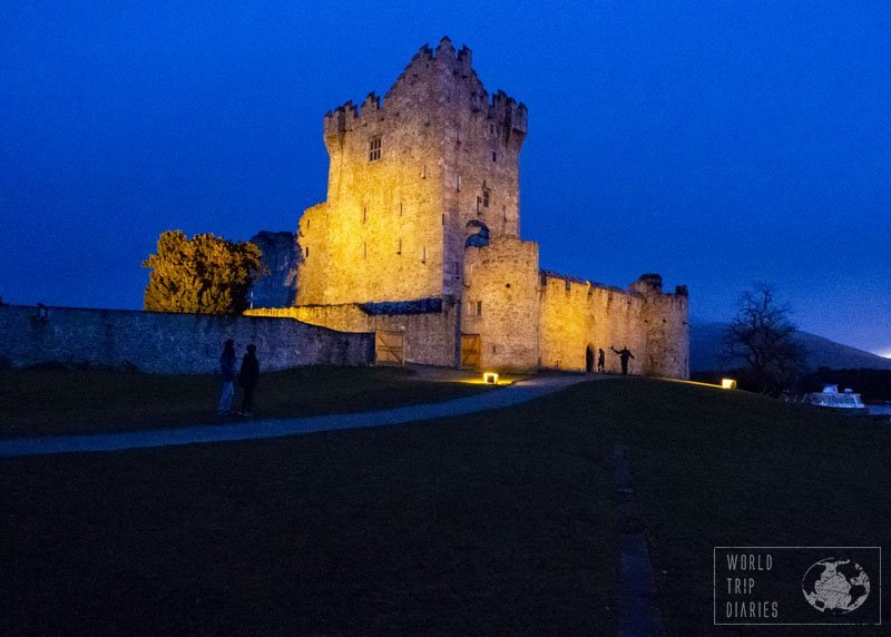 Ross Castle, in Ireland, at night. The sky is a royal blue and there are spotlights lighting the castle. We weren't even going to stop there, but I'm glad we did. We had lots of fun. 