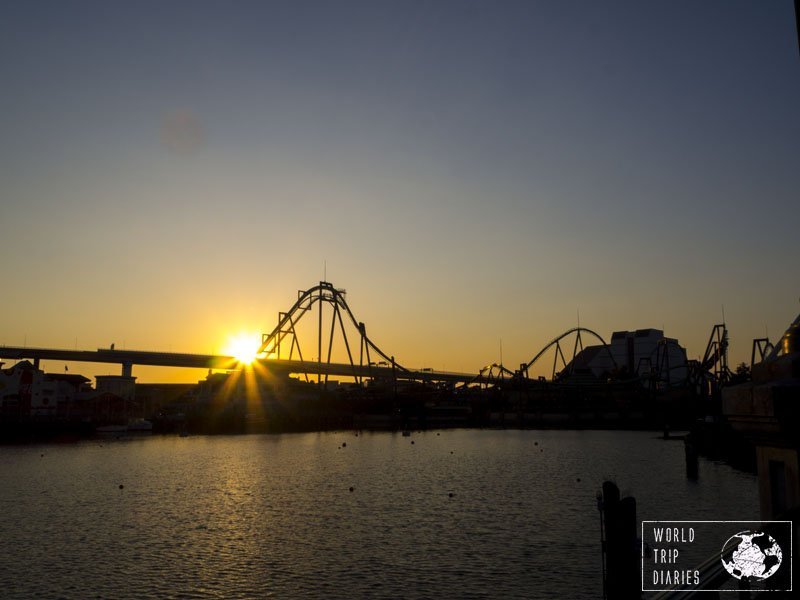 The sun setting behind a roller coaster at Universal Studios Japan. We always stop there to appreciate the view of the sunset against the silhouette of the roller coaster!