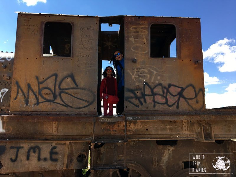 Uyuni Train Cemetery, Bolivia, South America, with kids