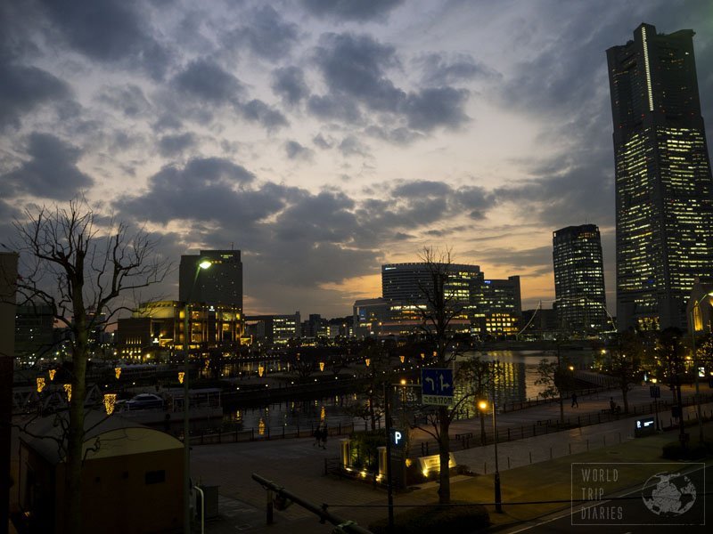 Yokohama, in Japan, with its buildings and a river just after sunset. It's a magical moment.